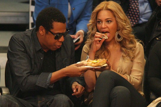 Jay-Z and Beyonce enjoy some junk food at a Lakers game.