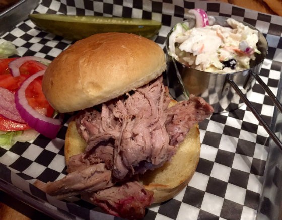 The pulled pork sandwich comes with your choice of side for $10. - Photo by Sarah Fenske