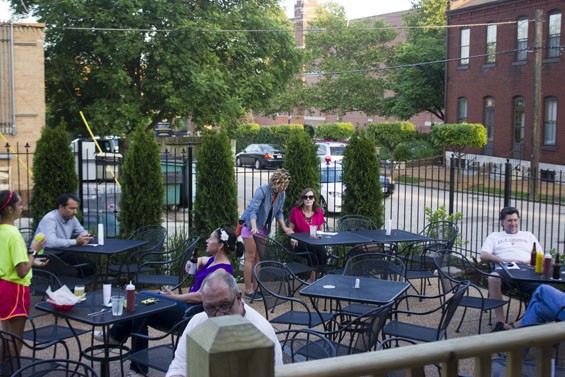 The patio is bare-bones, but an easy place to snag a seat on a warm summer night. - Photo by Sarah Fenske