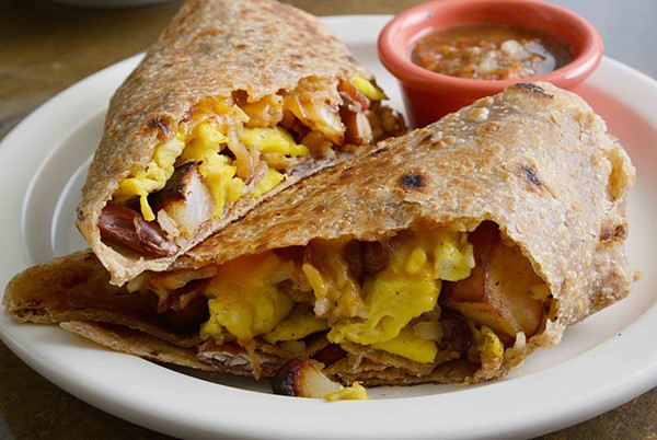 The breakfast burrito features egg, bacon, cheese, potato, kidney beans and homemade salsa on the side. - TOM HELLAUER
