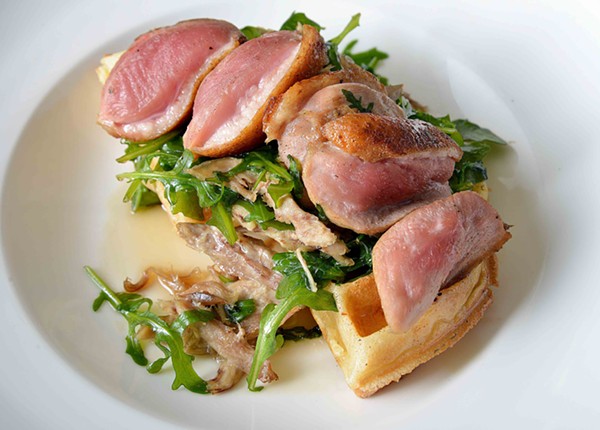 The duck and waffles is just one of many gluten free dishes for those with allergies or diets. - Tom Hellauer