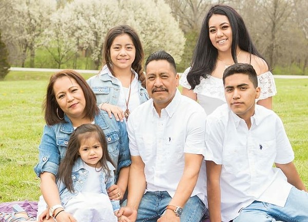 Wilian Ramos, center, with his family. - COURTESY OF RAMOS LANDSCAPING LLC