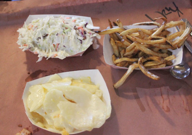 From top: Coleslaw, fries and a three-cheese potato gratin special at Sugarfire. - Photo by Lauren Milford