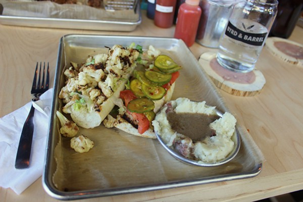The cauliflower Po Boy with mashed potatoes and mushroom gravy on the side. - Photo by Lauren Milford