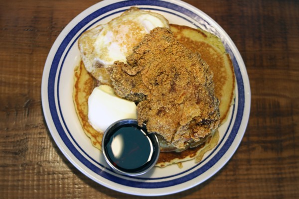 Johnny cakes and chicken is served with an egg. - Chelsea Neuling