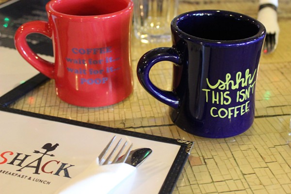 You can buy the Shack's coffee mugs for $10 each. - PHOTO BY LAUREN MILFORD