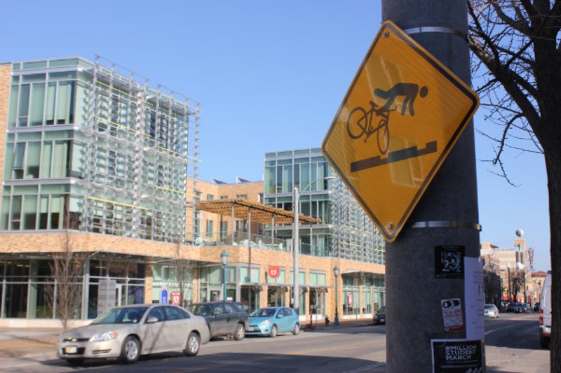 These new signs warn cyclists near the trolley tracks, which run the length of Delmar in the Loop area. - Photo by Sarah Fenske