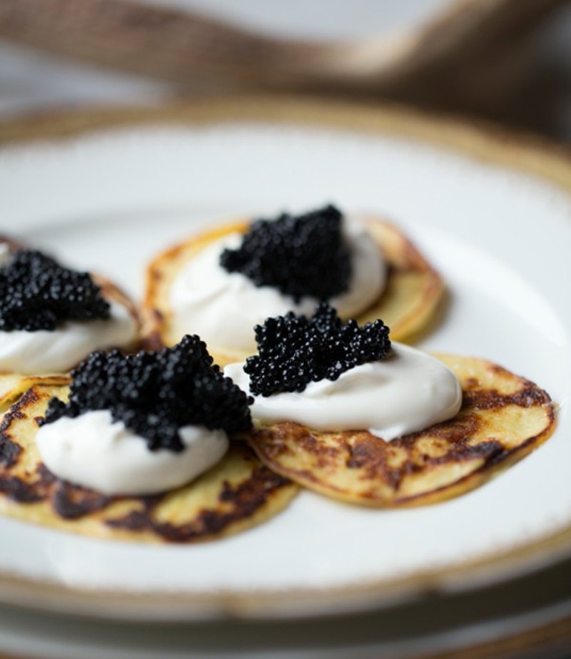 Bar Les Freres' potato blinis with caviar and creme fraiche. - Photo by Jennifer Silverberg
