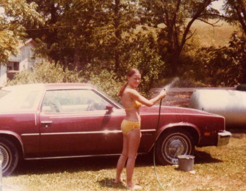 Judy washes her Oldsmobile, which was later found abandoned in a ditch on Route FF. - PHOTO COURTESY OF THE SPENCERS