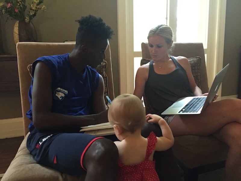 Jessica Herschend, with her toddler daughter, has taken in Saddiq and is tutoring him for a possible college career. - PHOTO COURTESY OF J.R. BIERSMITH