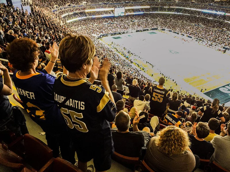 Former St. Louis Rams Isaac Bruce holds the Super Bowl trophy during  ceremonies celebrating the teams Super Bowl victory in the 1999-2000  season, at the Edward Jones Dome during half time of