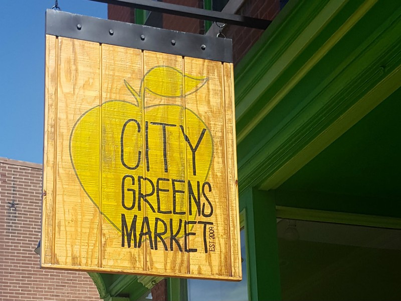 City Greens Market came to the Grove two years ago, after moving out of Midtown Catholic Charities' basement. Co-director Dylan Naylor hopes to reopen the market this month after losing funding from the charity. - KAVAHN MANSOURI