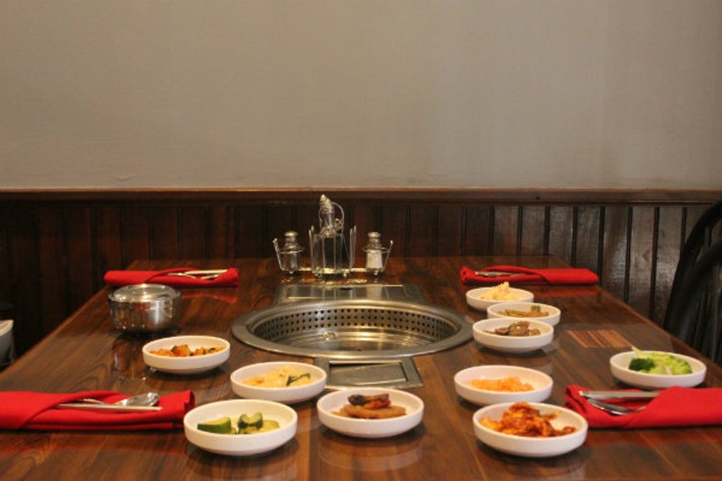 A table at Wudon filled with banchan, or small side dishes like different types of kimchi. - CHERYL BAEHR
