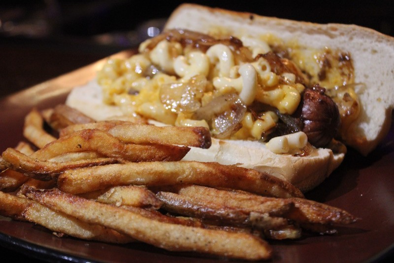 The "Second Line" dog is smothered with Andouille Gravy, creole mac n cheese, and fried onions. - PHOTO BY SARAH FENSKE