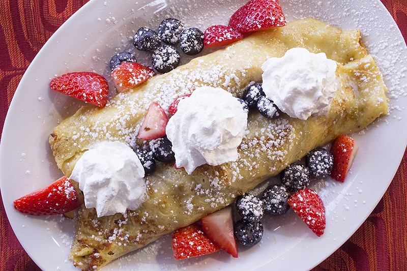 A berry crepe with whipped cream is a breakfast selection. - PHOTO BY MABEL SUEN
