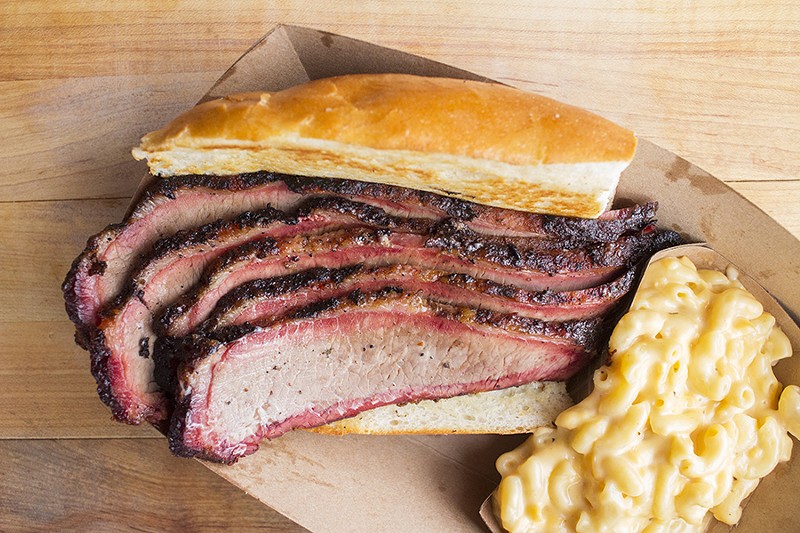 A brisket sandwich with a side of mac and cheese. - PHOTO BY MABEL SUEN