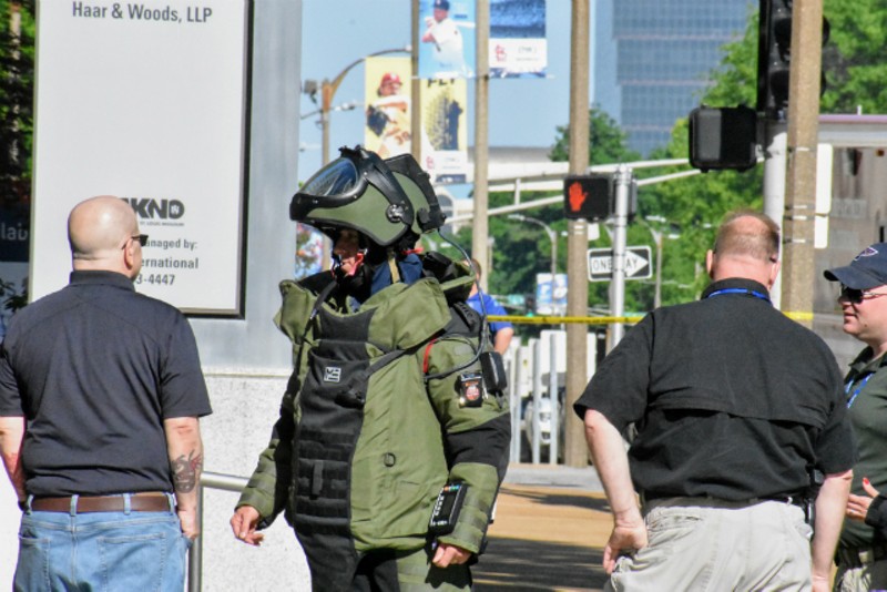 A member of the St. Louis Regional Bomb and Arson Unit waits outside KSDK on Tuesday morning. - DOYLE MURPHY