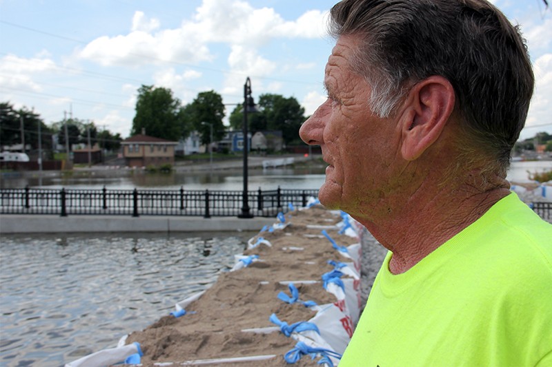 South St. Louis City resident Mike Byrne observes the flooded River Des Peres. - DANNY WICENTOWSKI