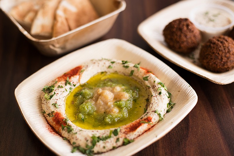 The hummus, shown alongside house falafel with tahini sauce, is first rate. - MABEL SUEN