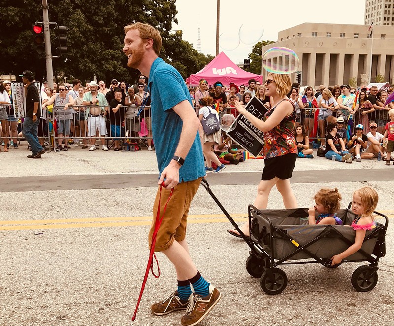 The author and his family march in a past Pride parade. - COURTESY OF PETER MERIDETH