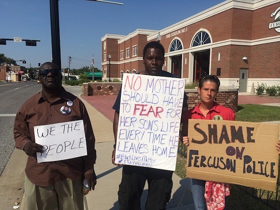Protester Angelique Kidd, far right, is among many people who previously sued Ferguson Officer Eddie Boyd for violating their rights. - MITCH RYALS