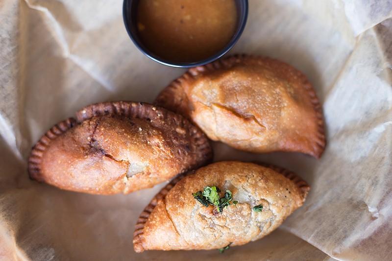Caribbean hand pies might be the best bites on the menu. - MABEL SUEN