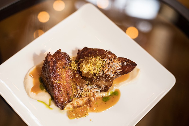 Braised pork belly pairs perfectly with a coconut-infused celery root purée and cooked apples. - MABEL SUEN