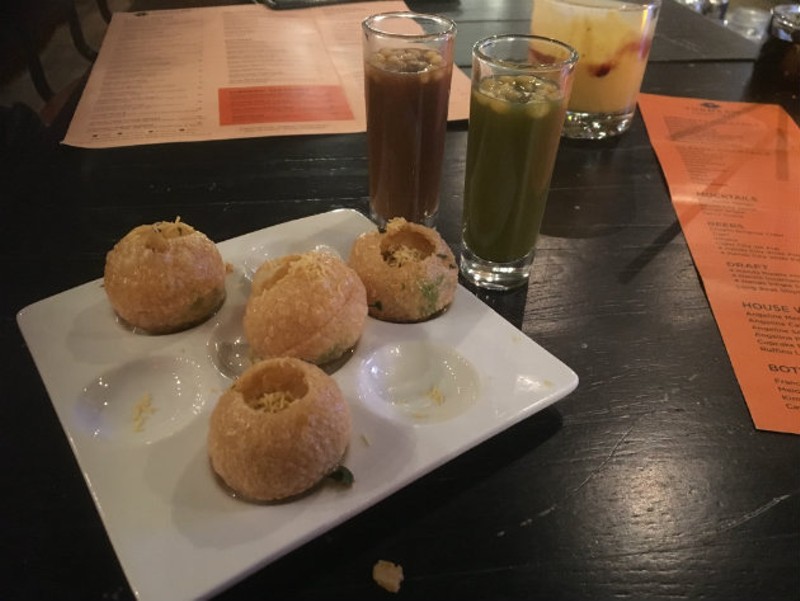 Golgappa, a popular Indian street food, filled with potatoes and chutney. - CHERYL BAEHR