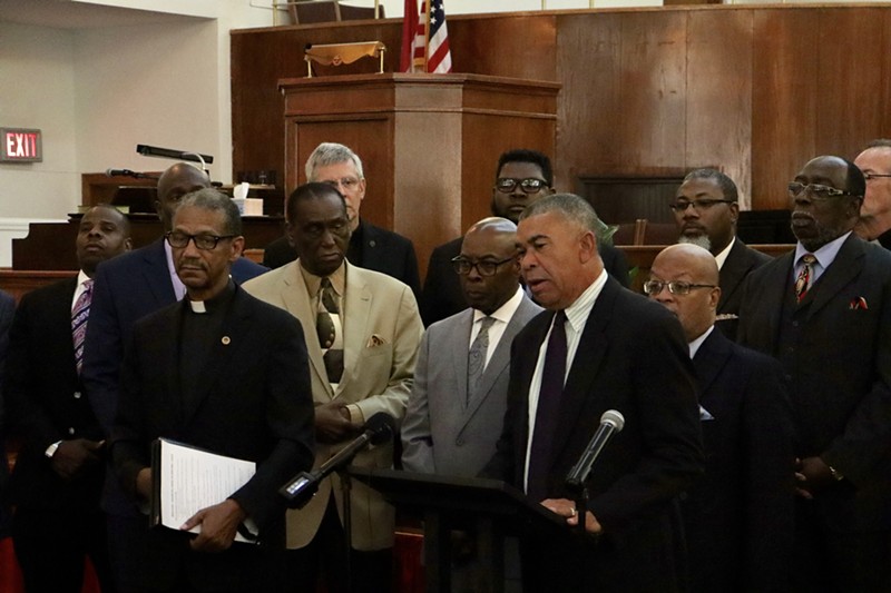 Congressman Lacy Clay, center, joined faith and political leaders in calling on the governor to address gun violence in St. Louis. - James Pollard