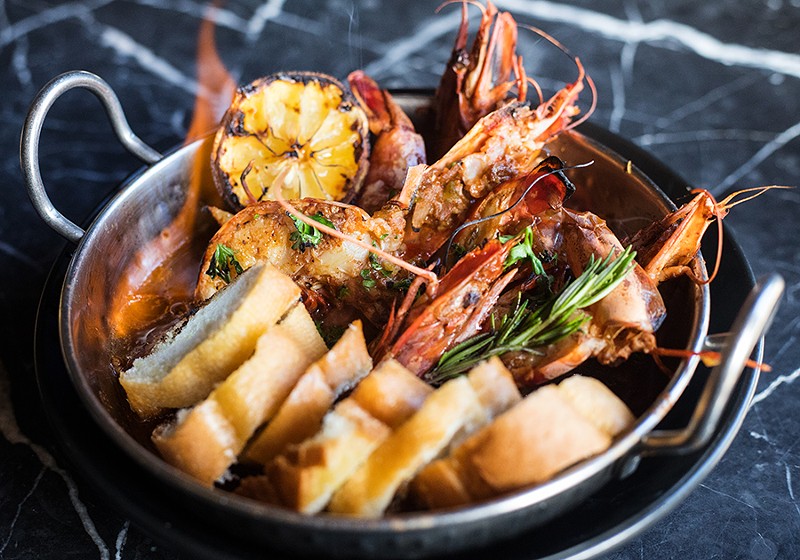 The “Flaming Wicked Prawns” serve jumbo head-on prawns in a broth of dark beer, sherry wine, Bait spice and fresh herbs. - MABEL SUEN
