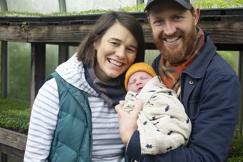 Mary Densmore, baby Autumn and James Meinert are stewards of the earth at Bee Simple City Farm. - ANDY PAULISSEN
