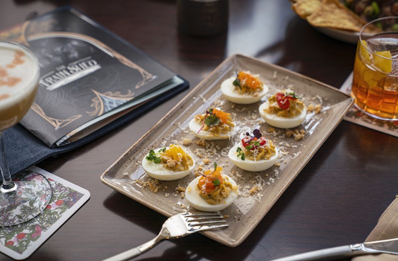 Green chile deviled eggs with pork rinds, pickled pepper and cotija cheese. - Courtesy of Lodging Hospitality Management