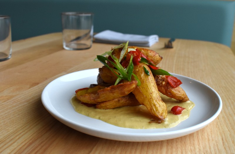 Crispy fingerling potatoes with little sweetie peppers, scallions and tomato. - LIZ MILLER