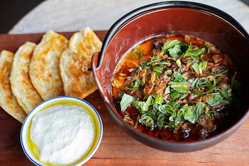 Short rib curry with red curry, labneh and roti flatbread. - MABEL SUEN