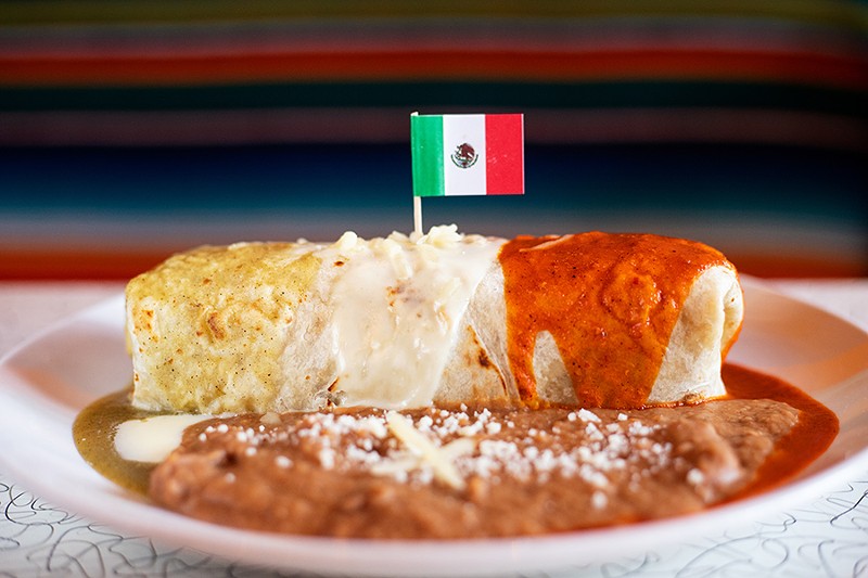 The Mexican Flag Burrito topped with salsa verde, queso blanco and salsa ranchero served with rice and beans. - MABEL SUEN