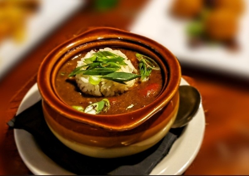 Carnival's menu pulls from Creole cuisine in dishes like this chicken-andouille gumbo. - KRISTEN FARRAH