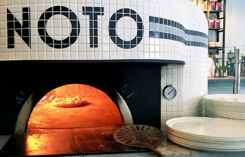The wood-fired oven at Noto. - KRISTEN FARRAH