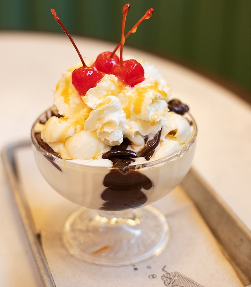 The All-American Sundae with ice cream, hot fudge, caramel, whipped cream and a cherry. - MABEL SUEN