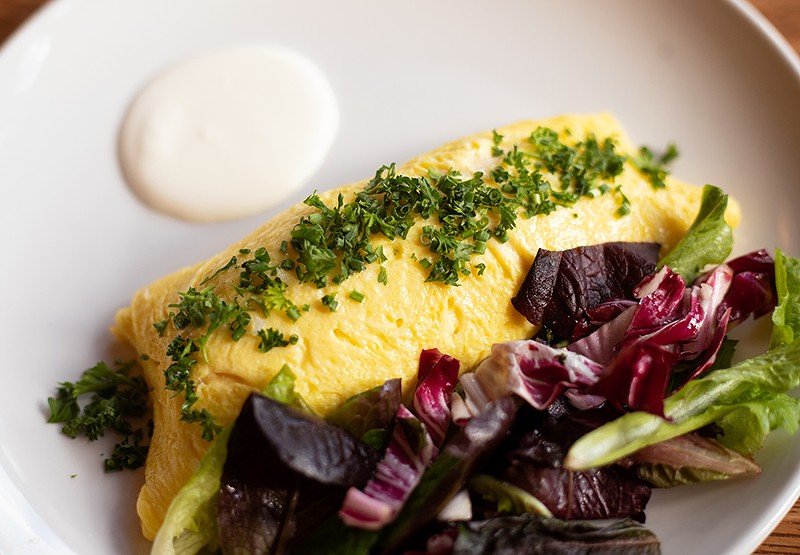 The crab omelet with Maine peekytoe crab, creme fraiche, fine herbs and petite greens. - MABEL SUEN