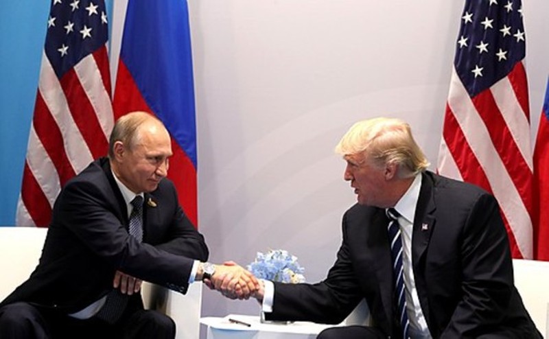 Vladmir Putin and Donald Trump shake hands in 2017. - WIKIMEDIA COMMONS