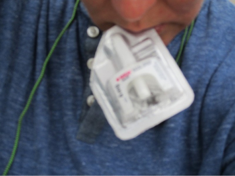 An image of a person with Narcan nasal spray, one of the photos in the show. - COURTESY PLACES FOR PEOPLE