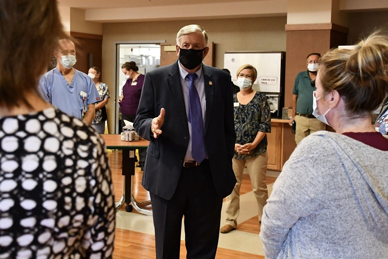 Governor Mike Parson tweeted this photo of himself meeting with staff on September 15 at Mount Vernon Veterans Home, which suffered a COVID-19 outbreak shortly after. - MIKE PARSON/TWITTER