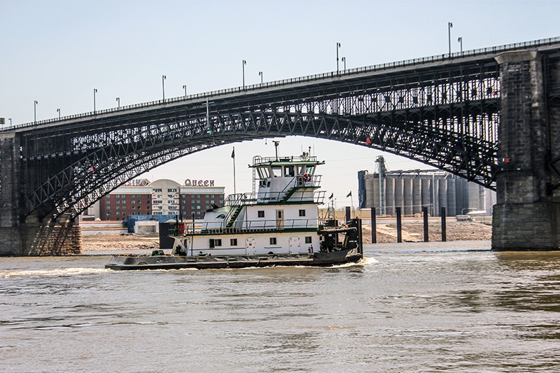 A tugboat passes under the Eads bridge connecting Missouri and Illinois. Both states earned a "C-" in infrastructure from the Biden administration. - DANNY WICENTOWSKI