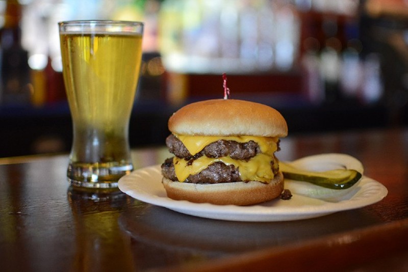 Burgers and beers have soothed generations of Village Bar regulars. - ANDY PAULISSEN