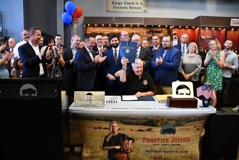 Gov. Mike Parson celebrates the signing of Missouri's Second Amendment Preservation Act" at a gun range. - MISSOURI GOVERNOR'S OFFICE/FLICKR