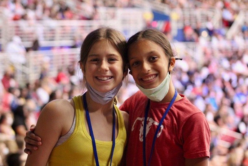 Gymnasts Elizabeth Ayers, left, and Lakshmi Coffey smile at Friday's trials after competing in their T&T gymnastics events earlier that day. - ZOE BUTLER