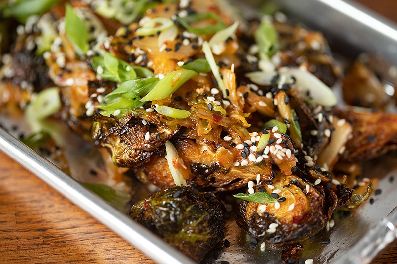 Kimchi brussels sprouts with fried sprouts, kimchi and toasted sesame. - MABEL SUEN