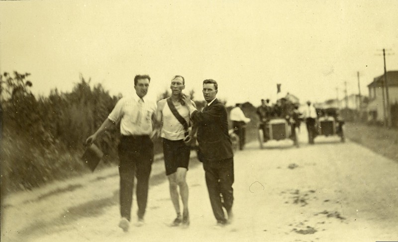 Thomas Hicks, one of the athletes in the 1904 Olympics, being supported by his trainers in the 24-mile marathon race. - COURTESY MISSOURI HISTORICAL SOCIETY
