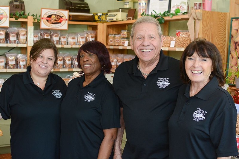 Byron Smyrniotis (third from left) with his crew at Mound City Shelled Nut Company. - ANDY PAULISSEN