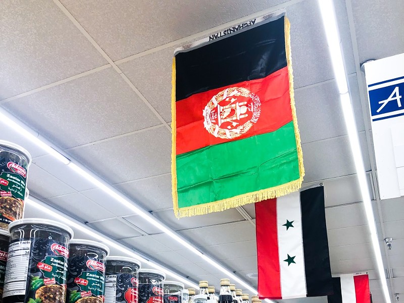 The Afghanistan flag in an aisle at Global Foods. - COURTESY GLOBAL FOODS
